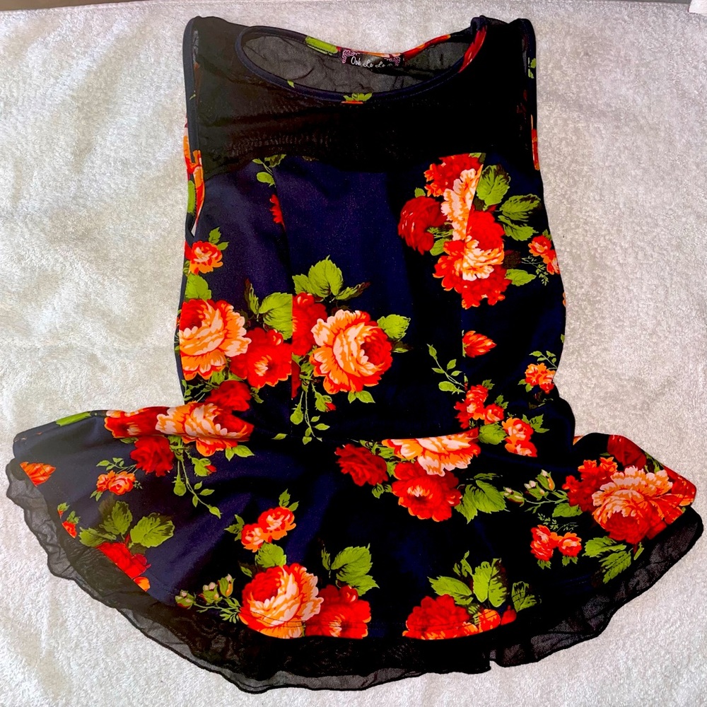 Floral peplum top with sheer accent